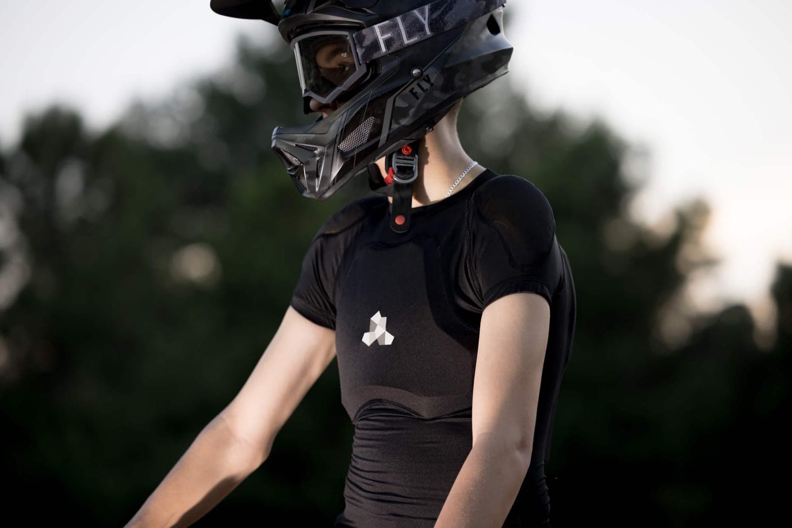 Liam G Adams in BMX race helmet at golden hour, 2025